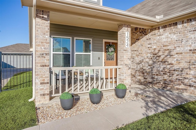 entrance to property featuring a porch