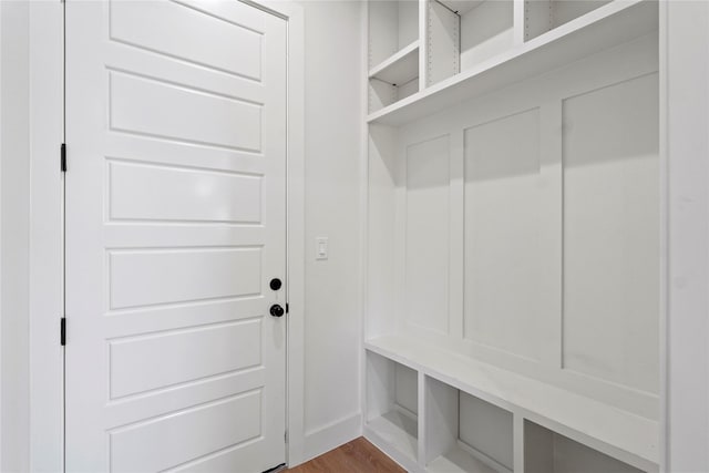 mudroom with wood-type flooring