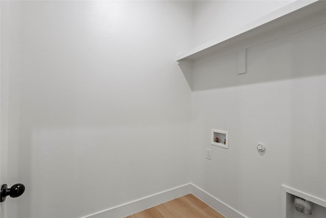 washroom featuring wood-type flooring and washer hookup