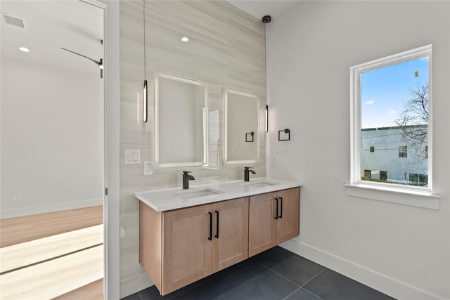 bathroom with tile patterned floors and vanity