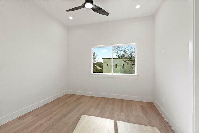 unfurnished room with ceiling fan and light hardwood / wood-style floors