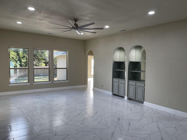 empty room featuring ceiling fan