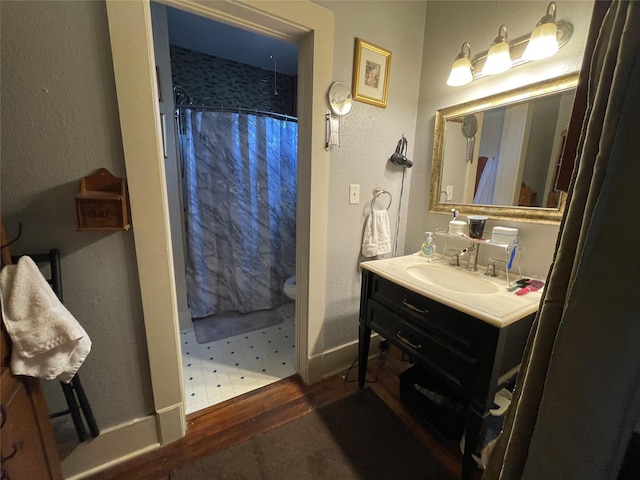 bathroom featuring vanity and a shower with curtain