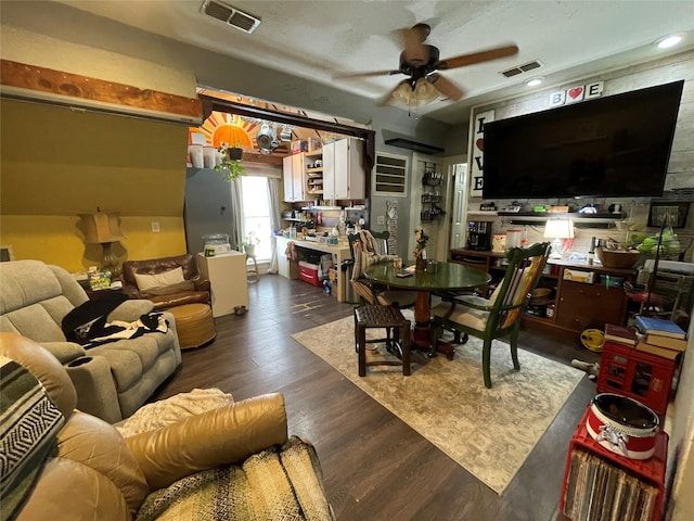 dining space with dark hardwood / wood-style floors and ceiling fan