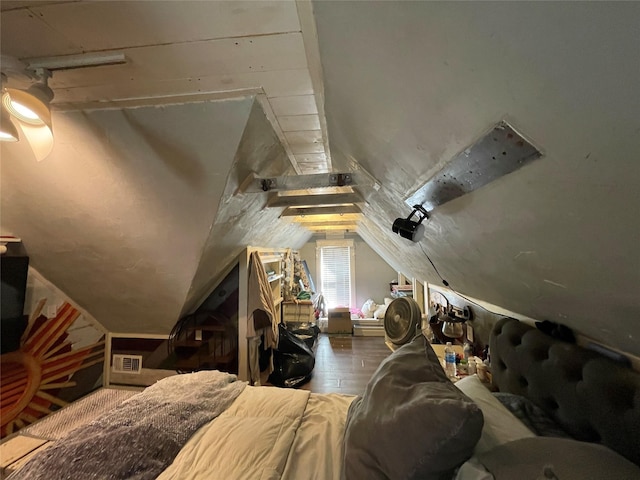 interior space with vaulted ceiling and hardwood / wood-style floors