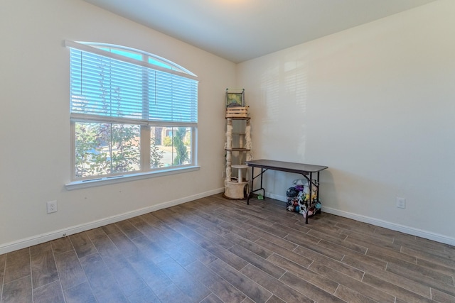 unfurnished room with dark hardwood / wood-style floors