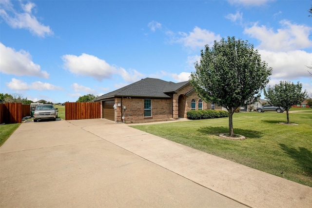 view of front facade with a garage and a front lawn