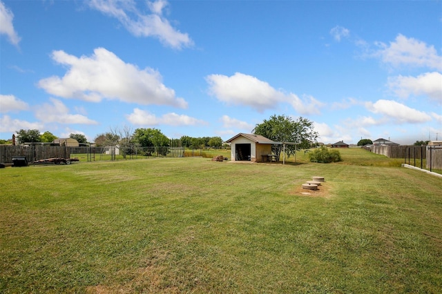 view of yard with a fire pit