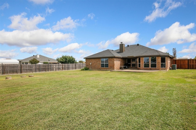 back of property featuring cooling unit, a patio area, and a lawn