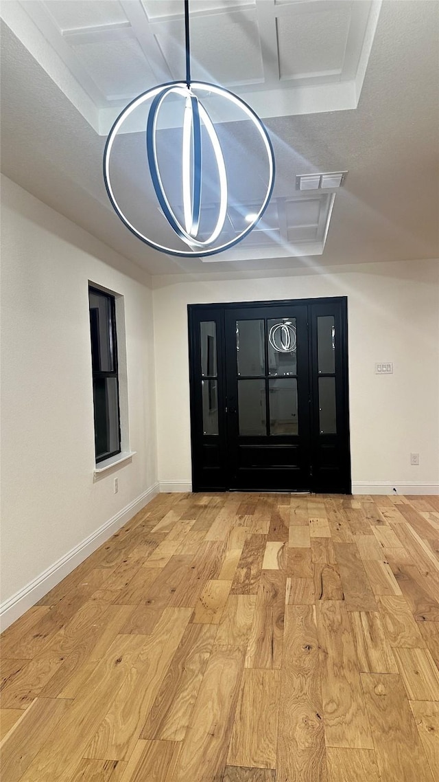 foyer with light hardwood / wood-style floors