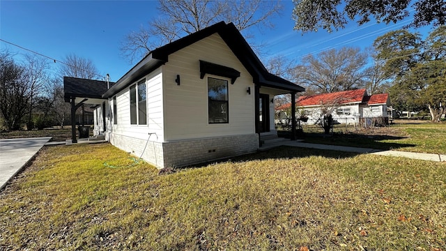 view of property exterior with a lawn