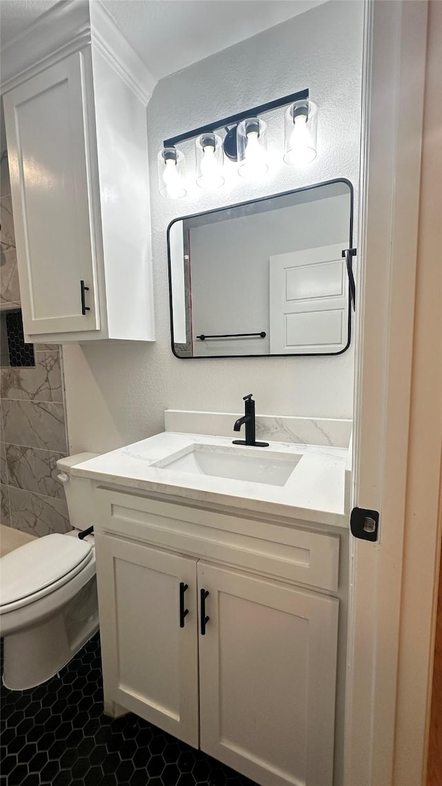 bathroom with vanity, tile patterned floors, and toilet