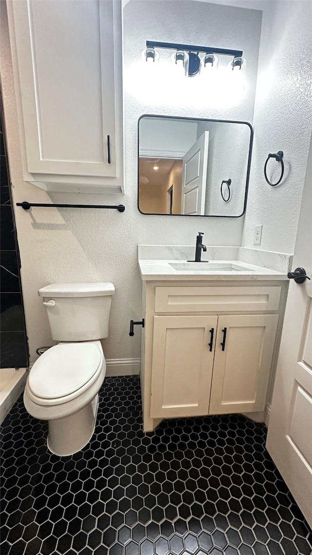 bathroom with vanity and toilet