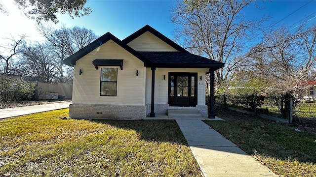 bungalow with a front yard