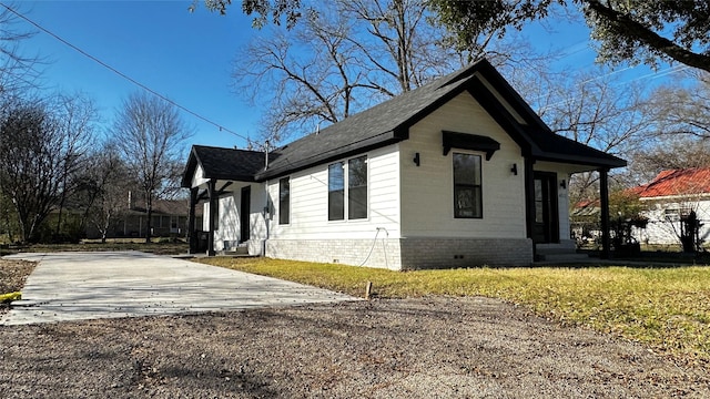 view of property exterior with a lawn