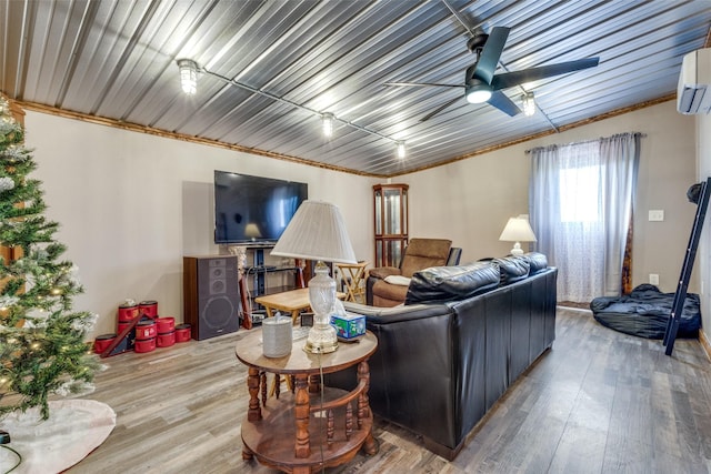 living room with ceiling fan and wood-type flooring