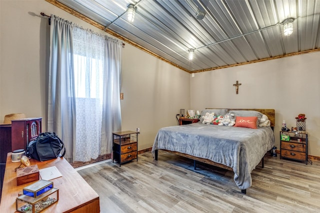 bedroom with hardwood / wood-style flooring