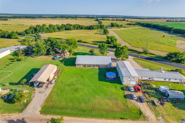 birds eye view of property with a rural view