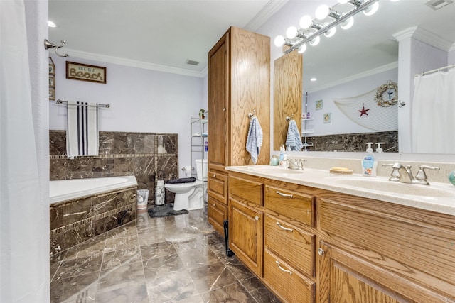 bathroom with crown molding, tiled bath, and vanity