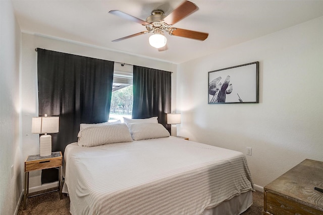 carpeted bedroom with a ceiling fan and baseboards