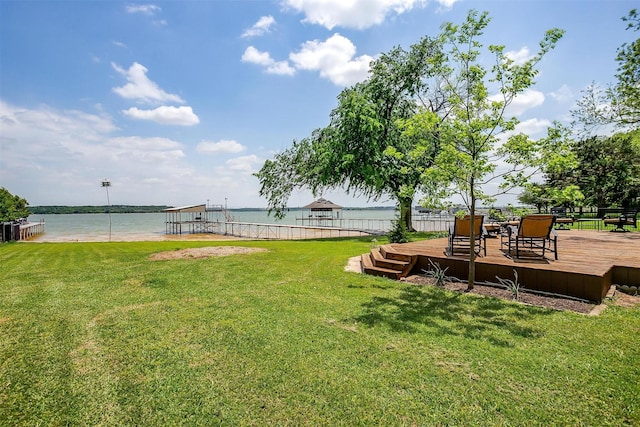 view of yard featuring a deck with water view