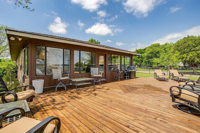 deck with grilling area and fence