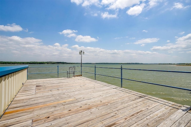 wooden terrace featuring a water view