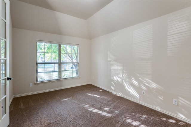 carpeted spare room with a notable chandelier and crown molding