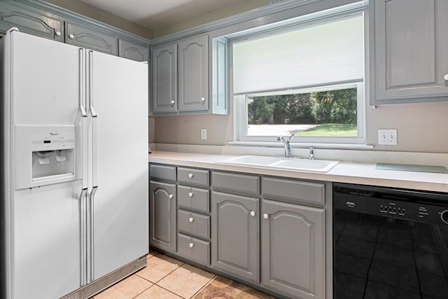 kitchen featuring gray cabinets, black dishwasher, sink, white fridge with ice dispenser, and light tile patterned floors