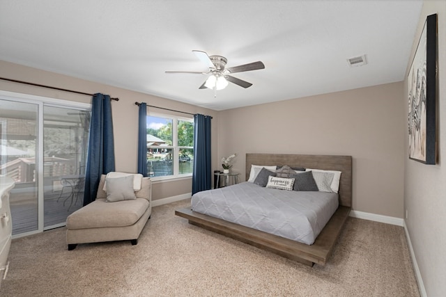 bedroom featuring ceiling fan, light colored carpet, and access to outside