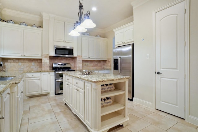 kitchen featuring a kitchen island, appliances with stainless steel finishes, pendant lighting, white cabinets, and ornamental molding