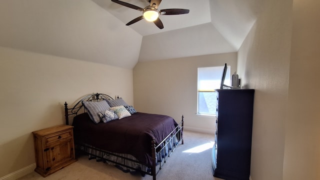 bedroom featuring lofted ceiling, light carpet, and ceiling fan