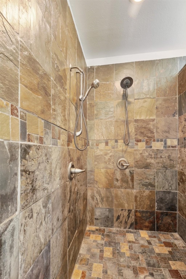 bathroom with a tile shower