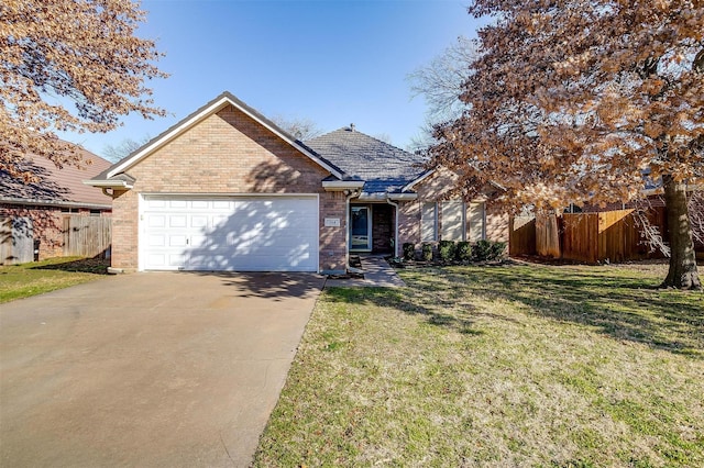 view of front facade with a garage and a front lawn