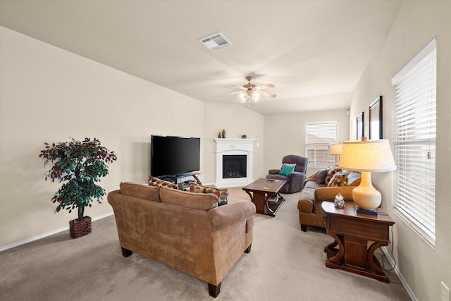 carpeted living room featuring ceiling fan