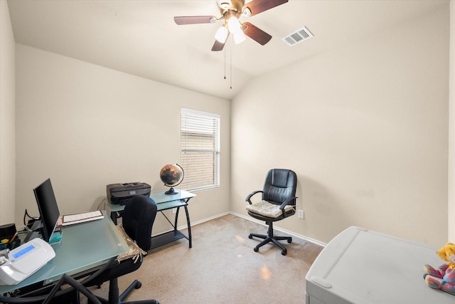 carpeted home office featuring lofted ceiling and ceiling fan