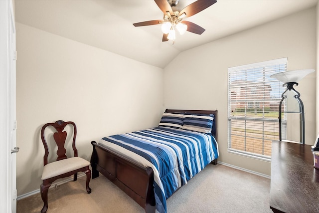 bedroom with ceiling fan, lofted ceiling, and light carpet