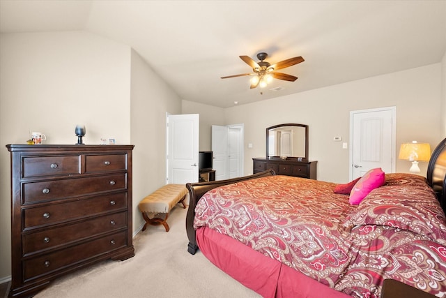 carpeted bedroom featuring ceiling fan and vaulted ceiling