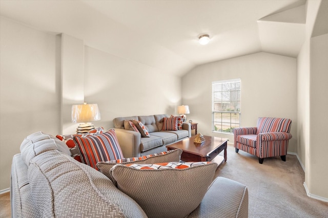 carpeted living room with vaulted ceiling