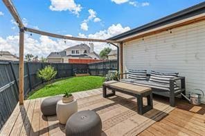 wooden terrace featuring an outdoor hangout area