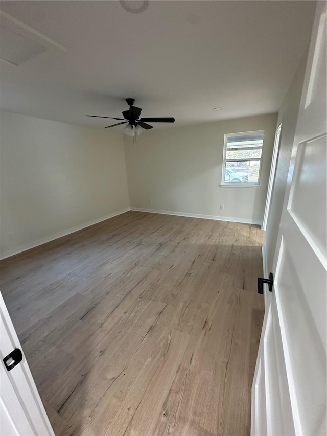 spare room with ceiling fan and light hardwood / wood-style flooring