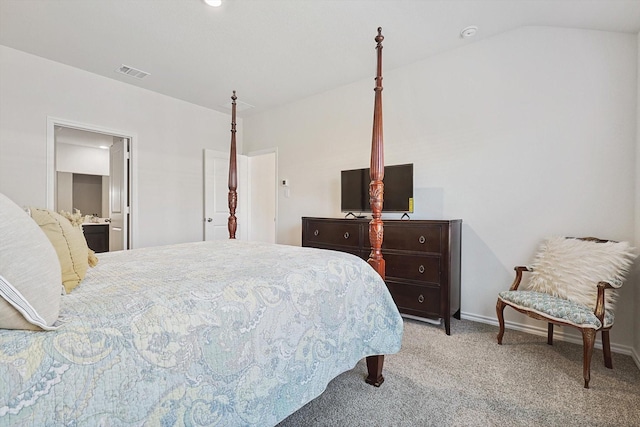 carpeted bedroom with vaulted ceiling