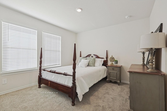 bedroom featuring light colored carpet