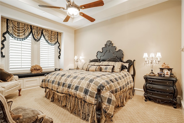 carpeted bedroom featuring ornamental molding and ceiling fan