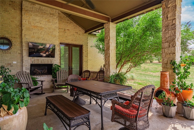 view of patio with an outdoor stone fireplace