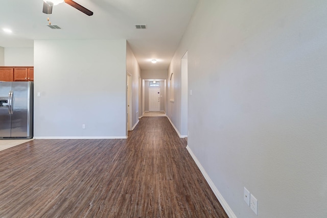 interior space featuring dark hardwood / wood-style flooring and ceiling fan