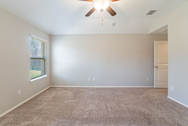 unfurnished room featuring lofted ceiling, light carpet, and ceiling fan