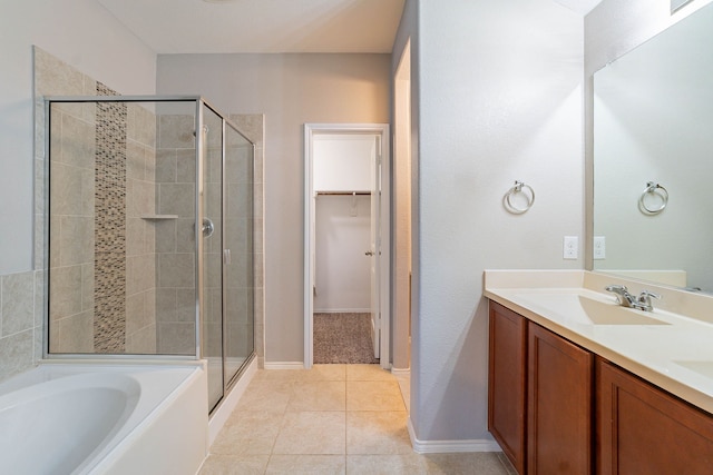 bathroom featuring tile patterned flooring, vanity, and independent shower and bath