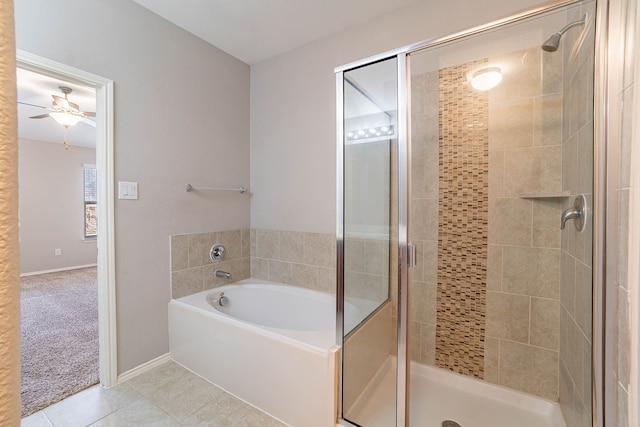 bathroom with ceiling fan, separate shower and tub, and tile patterned flooring