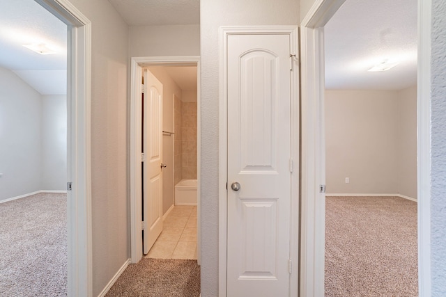 corridor with light carpet